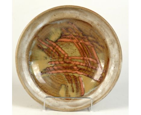 A studio pottery stoneware bowl, probably Leach, with finger wipe decoration. Diameter 31.5cm. Two exhibtion labels.  Conditi