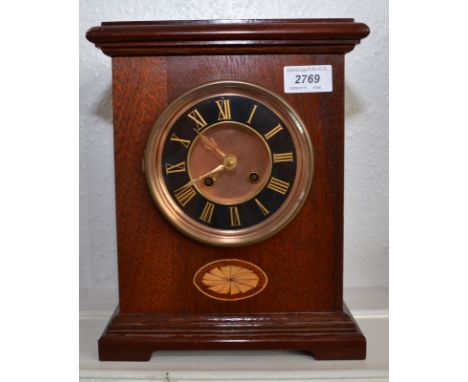 A mahogany cased mantle clock.