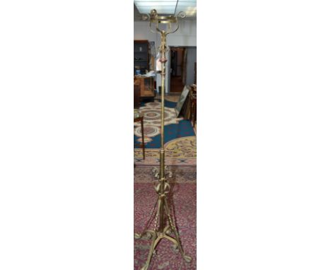 An Edwardian brass standard lamp, lacks burner.