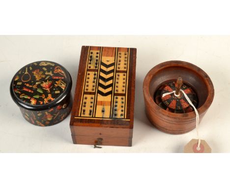 A 19th century toy Treen roulette wheel, together with a Clark & Co's cottons box patterned with toys on a black ground and a