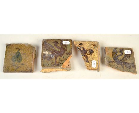 A Bernard Leach floral tile, 10 x 10cm and three other tile fragments. 