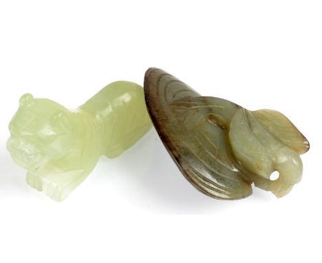 A jade muscle shell with attached seaweed with a jade carving of a recumbent tiger. 