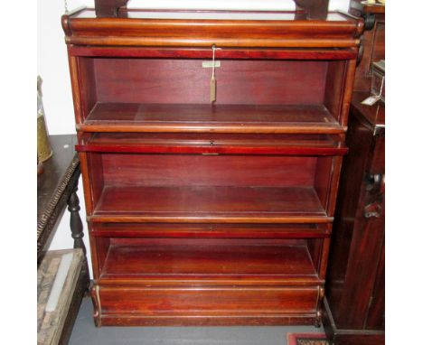 A Globe-Wernicke mahogany three tier sectional bookcase, width 86.5cm.