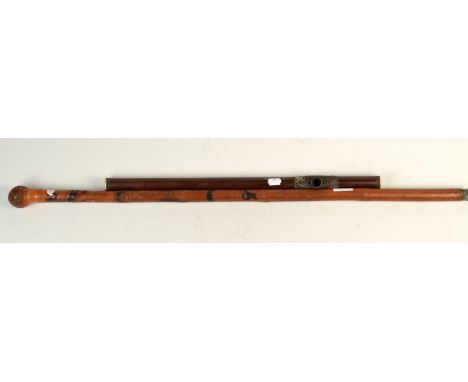 An oriental bamboo walking cane carved with figures, length 90cm, together with an oriental hardwood pipe, length 53.5cm.