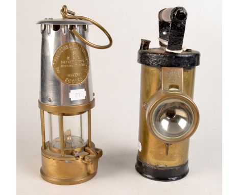 A miner's steel and brass safety lamp by The Protector Lamp & Lighting Co. Ltd, Eccles, together with a CEAG battery operated