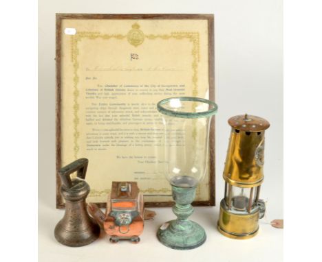 A Georgian ex War Department bell shaped weight, together with a tea caddy, a British Guiana War service certificate, a miner