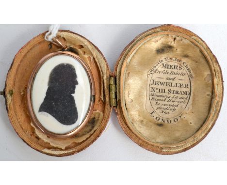 A miniature silhouette portrait of a gentleman by John Miers in gold pendant mount the back enamelled and with a plated lock 