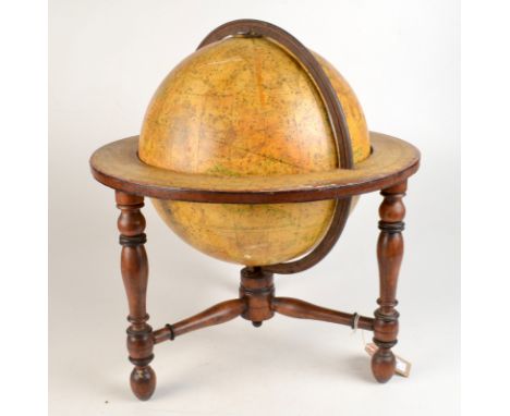 A George IV Newton's celestial tabletop 12 inch globe dated 1824 with an iron meridian ring on turned mahogany stand, height 