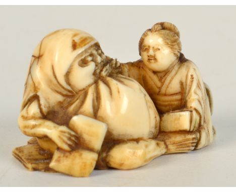 A late 19th century ivory netsuke of a seated figure of Daruma in his nine years of meditation, and the Japanese lady is feed