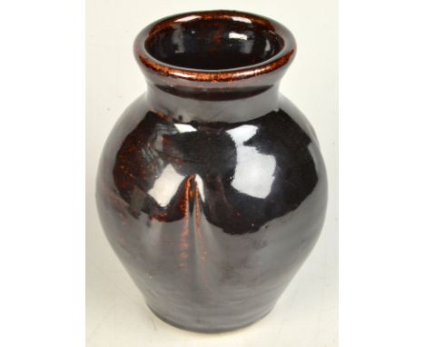 A Trevor Corser Leach Pottery stoneware vase with indented sides, clear seal marks to side, height 17cm.  Good condition. 