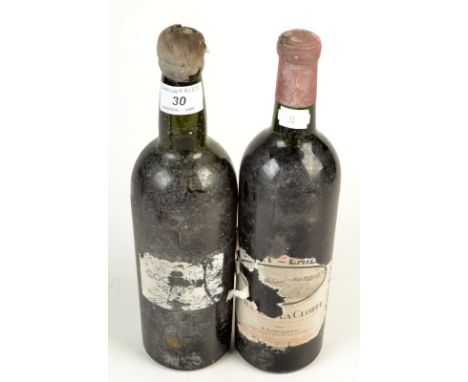 A bottle of St Emilion Chateau La Clotte and a bottle of vintage port 1947.  Condition Report:
Port liquid 1/2" below shoulde
