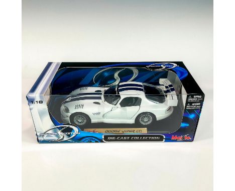 A factory sealed, replica die cast model Dodge Viper in a white and blue exterior. With moveable parts. This item has its ori
