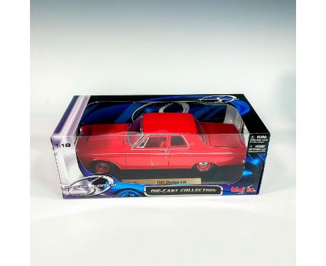 A factory sealed, replica die cast model Dodge in a red exterior and interior. With moveable parts. This item has its origina
