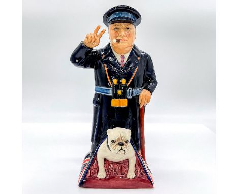 Limited edition hand decorated jug featuring the British prime minister Winston Churchill with a bulldog under, standing on t