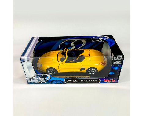 A factory sealed, replica die cast metal convertible designed with a glossy yellow exterior and a deep purple interior. Inclu