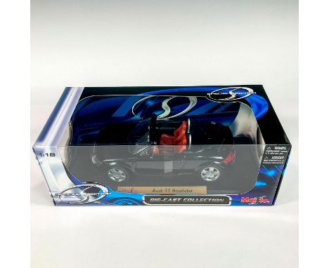 A factory sealed, replica die cast metal convertible designed in a black exterior with a burnt orange interior. includes a bl