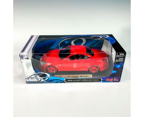 A factory sealed, replica die cast model Lexus with red exterior. With moveable parts. This item has its original box: 12.5â€
