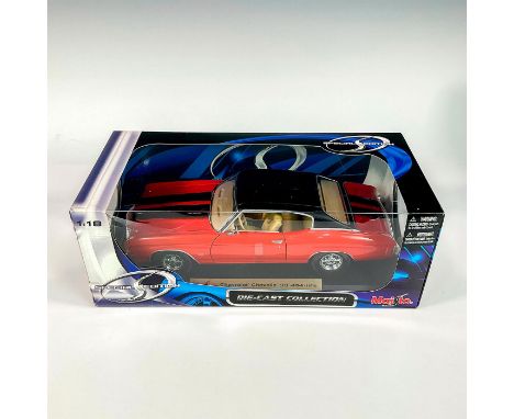A factory sealed, replica Chevrolet Chevelle SS 454 designed in a red and black exterior with cream colored interior, with de