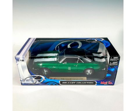 A factory sealed, replica die cast metal Chevrolet Camaro Z/28 designed in a green and white exterior with a black exterior, 