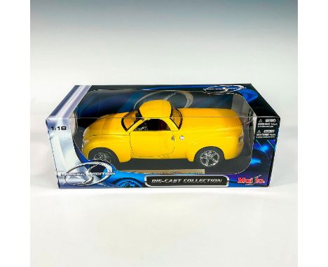 A factory sealed, replica die cast model Chevrolet SSR in a yellow exterior. With moveable parts. This item has its original 
