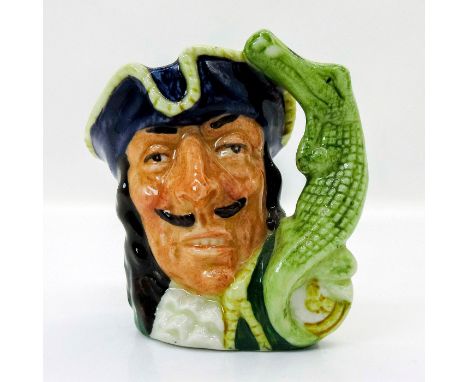 Style One, crocodile and clock handle. Blue tricorn trimmed with yellow; green coat trimmed with yellow; white ruffles at the