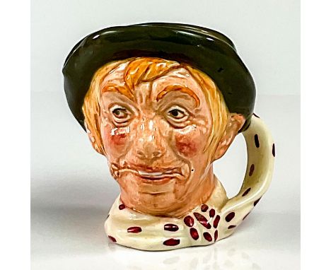 Green cap; white scarf with red polka-dots.Jarge, the colloquial version of George, is a typical country bumpkin, with his po
