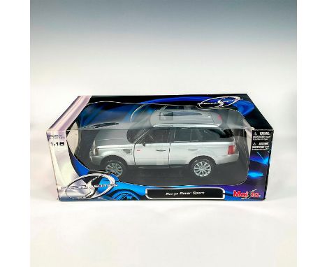 A factory sealed, replica model SUV designed in a gray exterior with a black interior. Includes a black display stand. This i