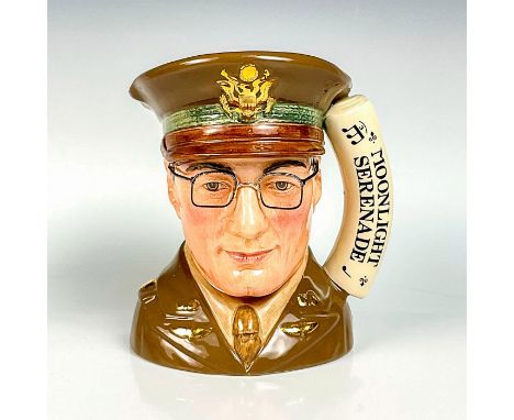 Browns and beige coloration.This jug commemorates the 50th anniversary of the disappearance of Glenn Miller in an airplane ov