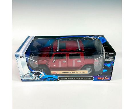 A factory sealed, replica die cast model Hummer in a red exterior. With moveable parts. This item has its original box: 12.5â