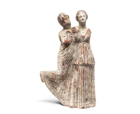  A Greek terracotta group of two dancing female figures Sicily, circa 220-200 B.C.One wearing a belted chiton, her hair centr