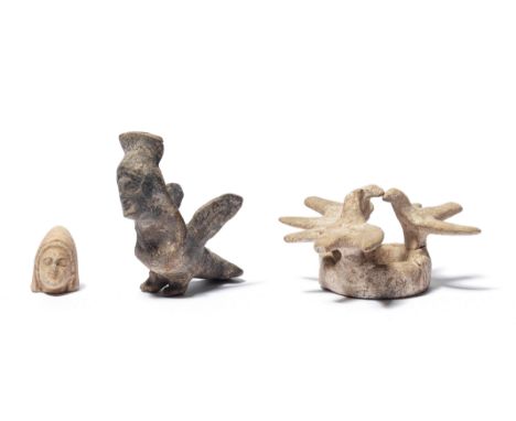  A Greek terracotta genre group with doves and a terracotta siren Circa 6th-4th Century B.C.The doves standing with spread wi