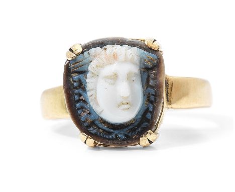  A Roman agate cameo of Medusa Circa 2nd-3rd Century A.D.Carved in two layers, the face turned slightly to the left, set in a