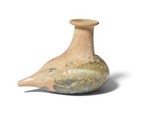  A Roman pale green glass feeder flask Circa 2nd-3rd Century A.D.The body modelled in the shape of a bird, the extended tubul