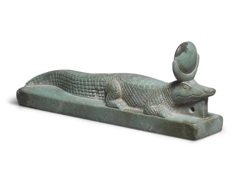  An Egyptian green steatite amulet in the form of the crocodile god Khenty-khety Late Period, circa 664-332 B.C.Naturalistica