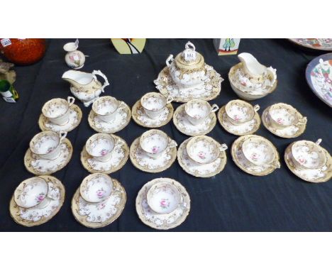 FLORAL TEA SERVICE. Tea service on floral and gilt detail with white ground, marked 2091 to below, approximately thirty five 