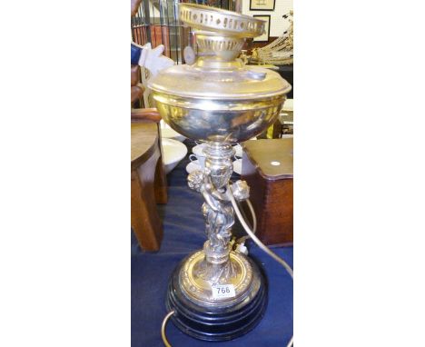 LAMP BASE. Brass paraffin lamp base with cherub detail, converted to electric, H ~ 50cm