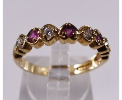 9CT RUBY HALF ETERNITY RING. 9ct gold ruby set half eternity ring, size O/P