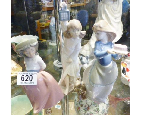 THREE NAO FIGURINES. Three Nao figurines by Lladro