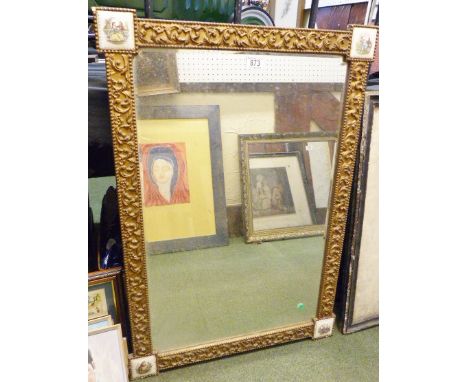 BEVELLED EDGE MIRROR.Gilt framed bevelled edge mirror with ceramic tile inserts to corners, 63 x 86cm