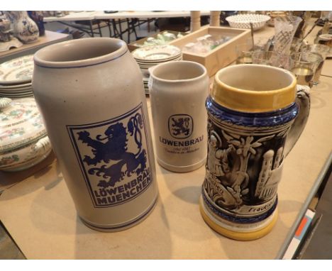 Two tankards one 2L and one 3L plain ceramic and one 1L with scenic decoration