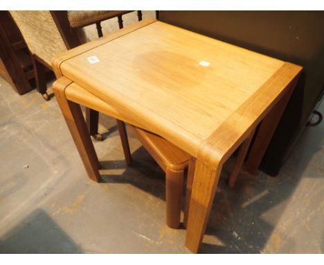 Nest of three light oak tables