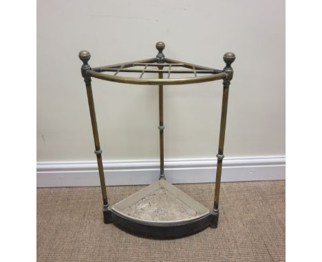 A Victorian brass corner Stick Stand on cast iron base, 2ft high