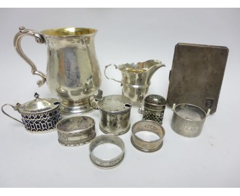 An Irish silver baluster Pint Mug with leafage scroll handle, Dublin 1968, a small helmet shape Jug, Chester 1900, four Napki