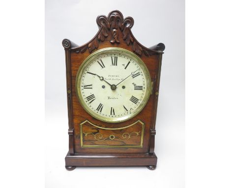 A Regency rosewood carved Bracket Clock with white enamel dial inscribed Purvis, North Audley St, London, two train fusee mov