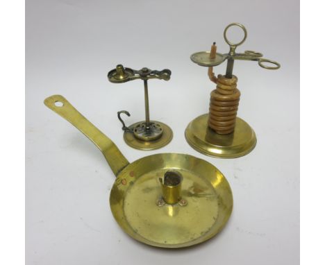 An antique brass Wax Jack on circular base, 7in, a brass Chamber Candlestick and another Wax Jack