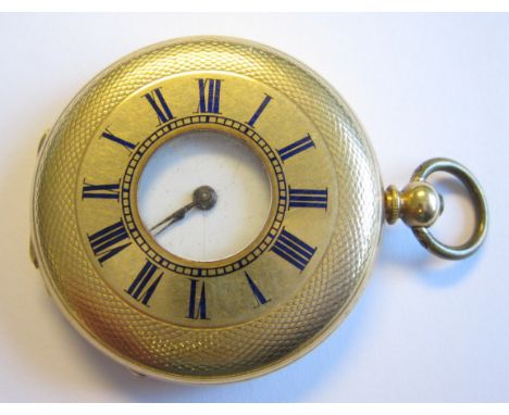 A Lady’s Half Hunter Pocket Watch in 18ct gold engine turned case, the white enamel dial with roman numerals