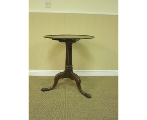 A Georgian style oak Pillar Table with circular dish top, fluted tapering column and tripod base, 2ft 1in D