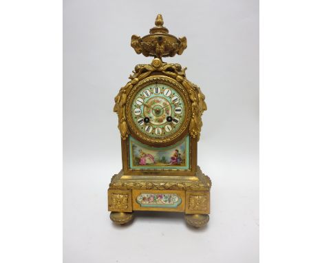A 19th Century French Mantel Clock by Japy Freres with Sevres style porcelain dial and other panels painted figures and flowe