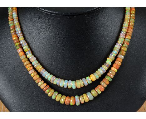 A double row of graduated faceted Opal Beads on clasp stamped 9ct