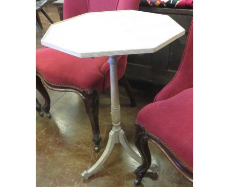 A limed oak octagonal Tripod Table, 2ft 4in H x 1ft 5in W